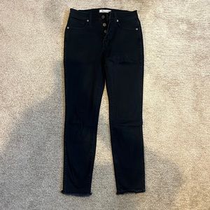Button fly black skinny jeans. Frayed bottom